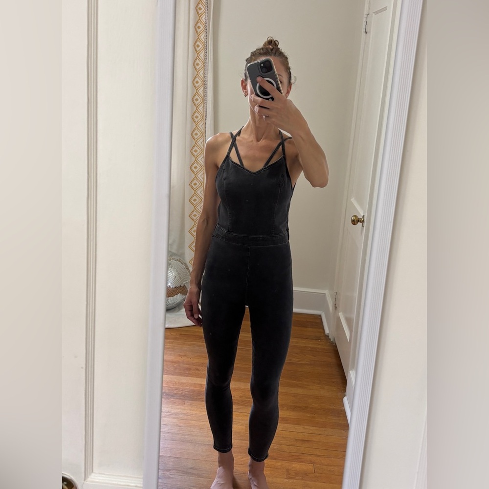 Topshop faded black denim jumpsuit. Size says 8 but fits like a 2-4
